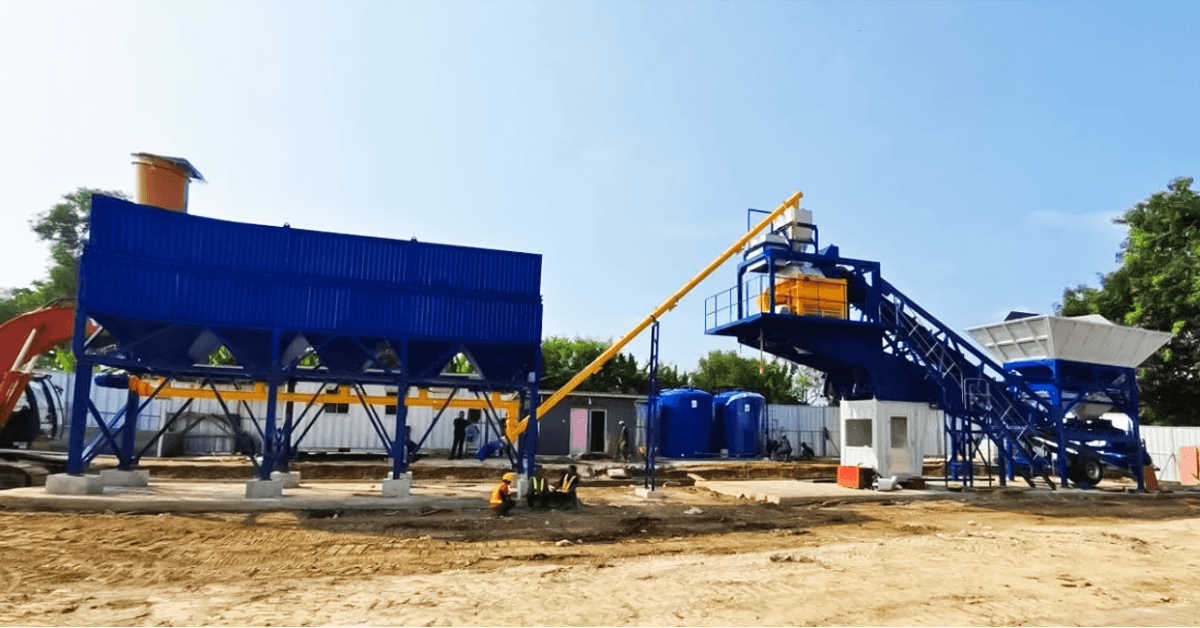 Engineers assembling mobile concrete batching plant
