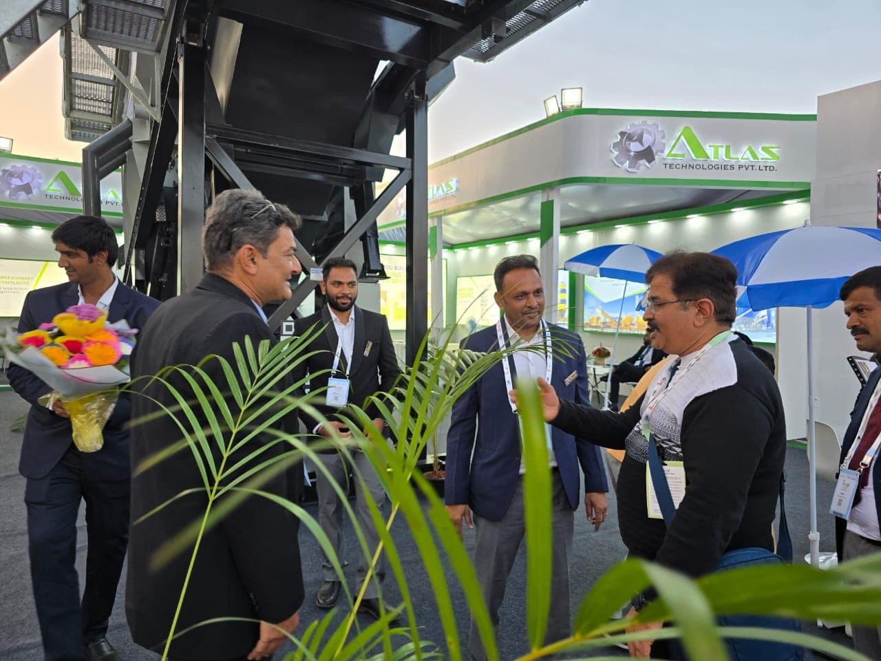 Visitors interacting with Atlas team at EXCON 2025